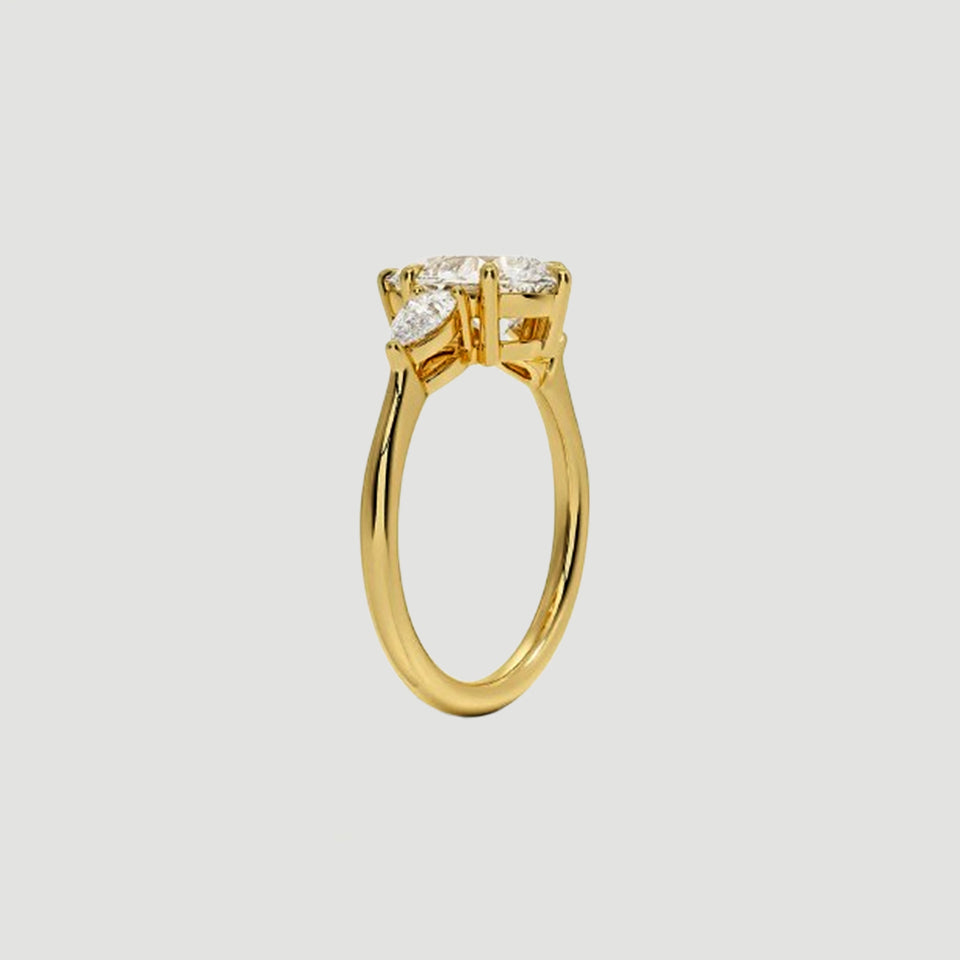 Moissanite Pear Three Stone Ring